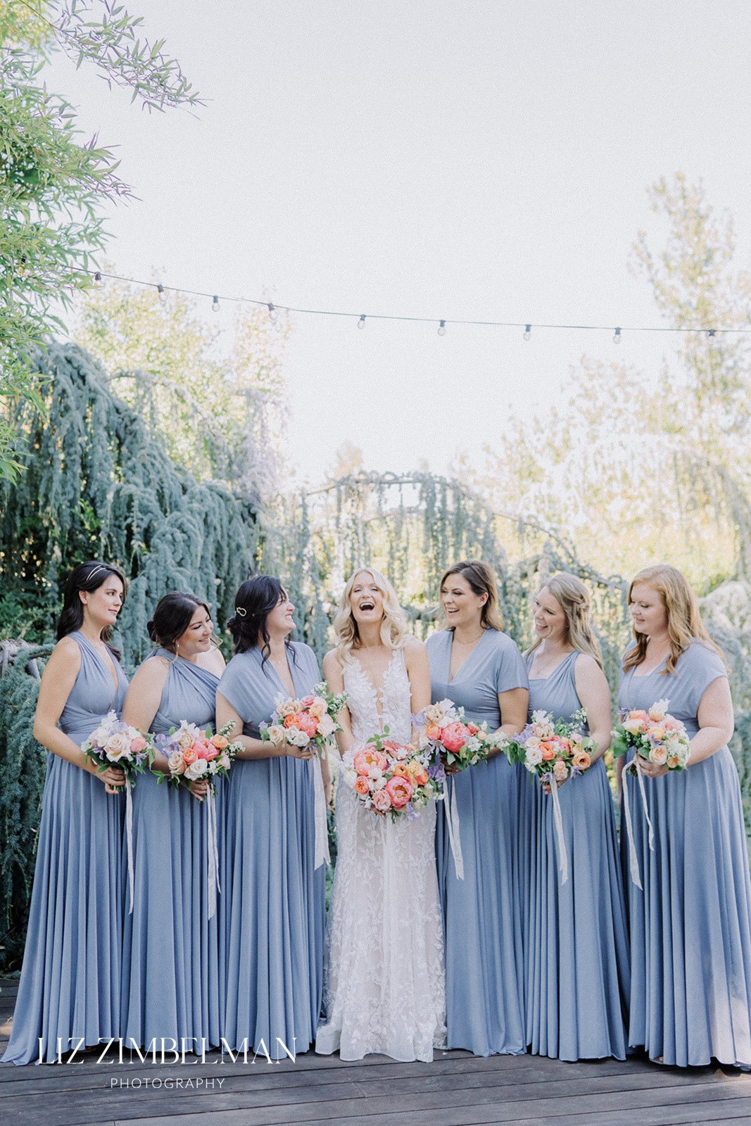 Bride with bridemaids in blue dresses